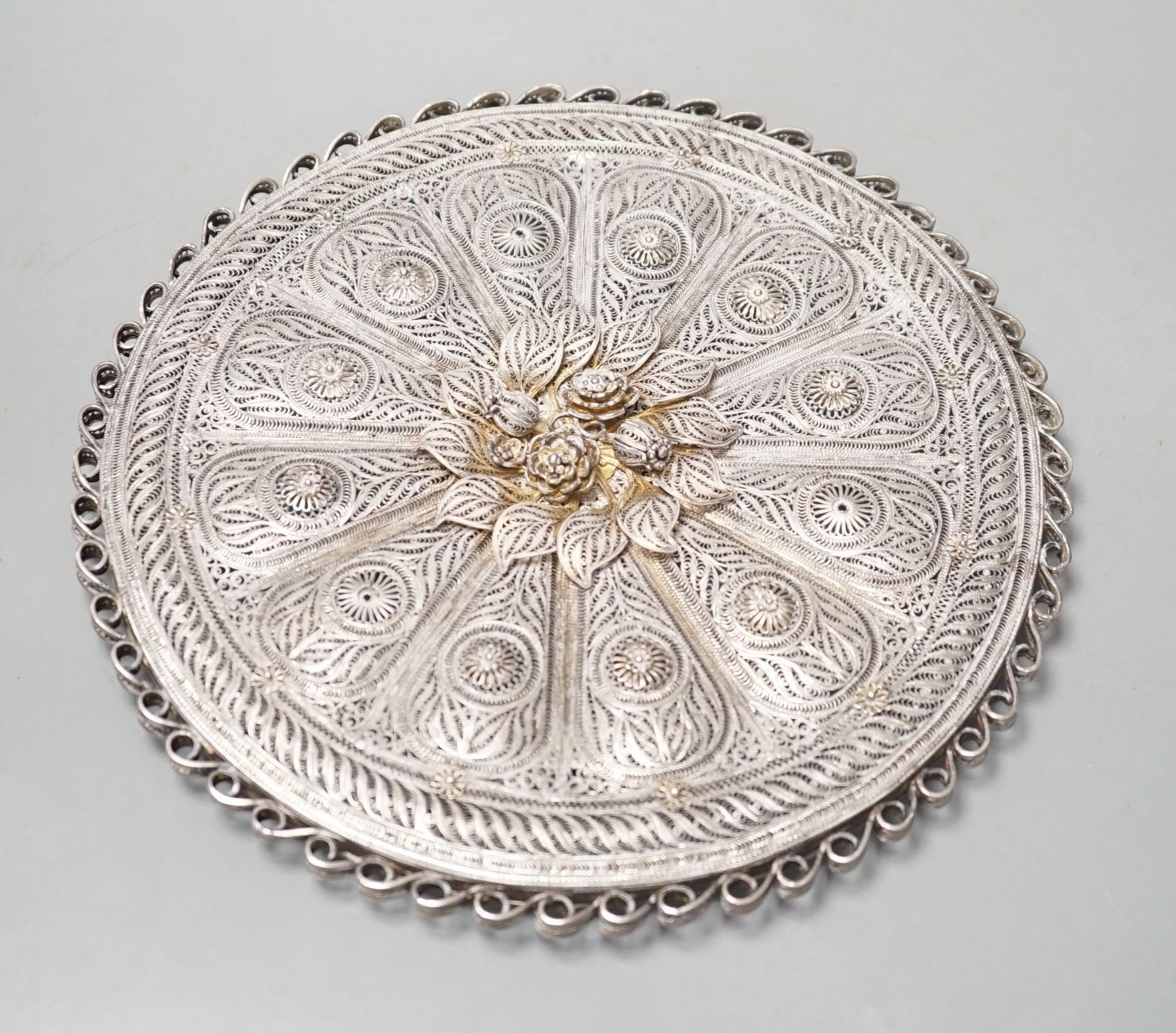 An Indian Goanese circular filigree work mirror, 23 cms diameter.